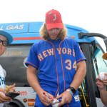 mets player signing autographs for ll players