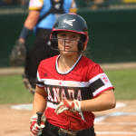 softball player running dugout