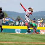 japan player jumping, mexico player sliding into second