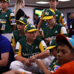 Cubs player playing video games with teams