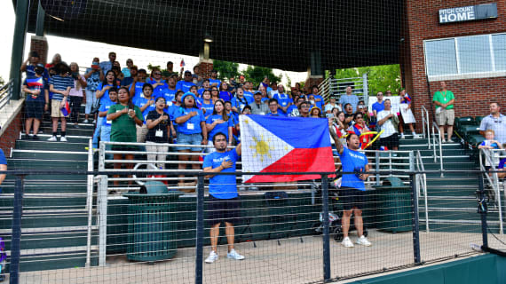 Fans of Team Asia-Pacific Sing their Anthem