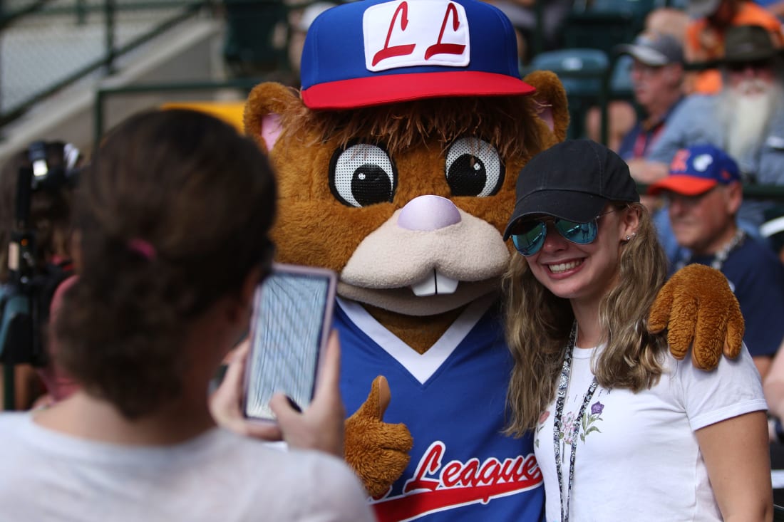 girl getting her picture with Dugout