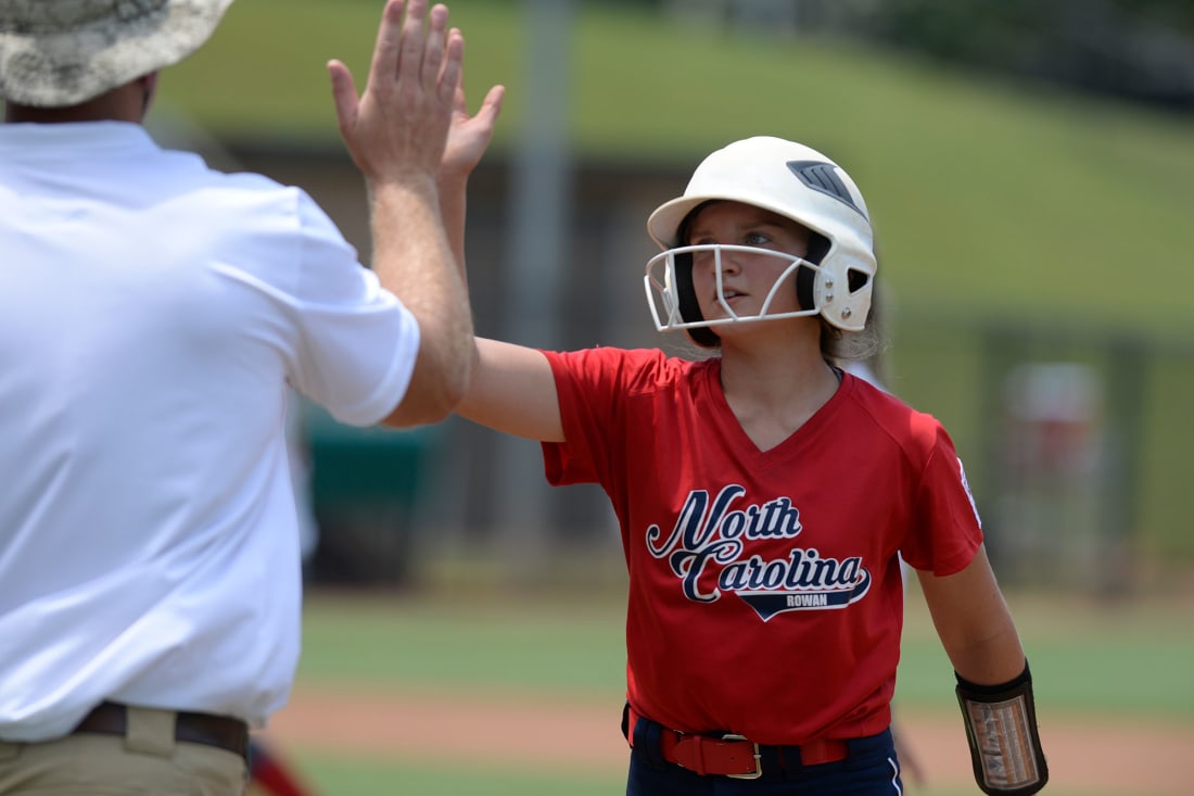 player highfiving coach