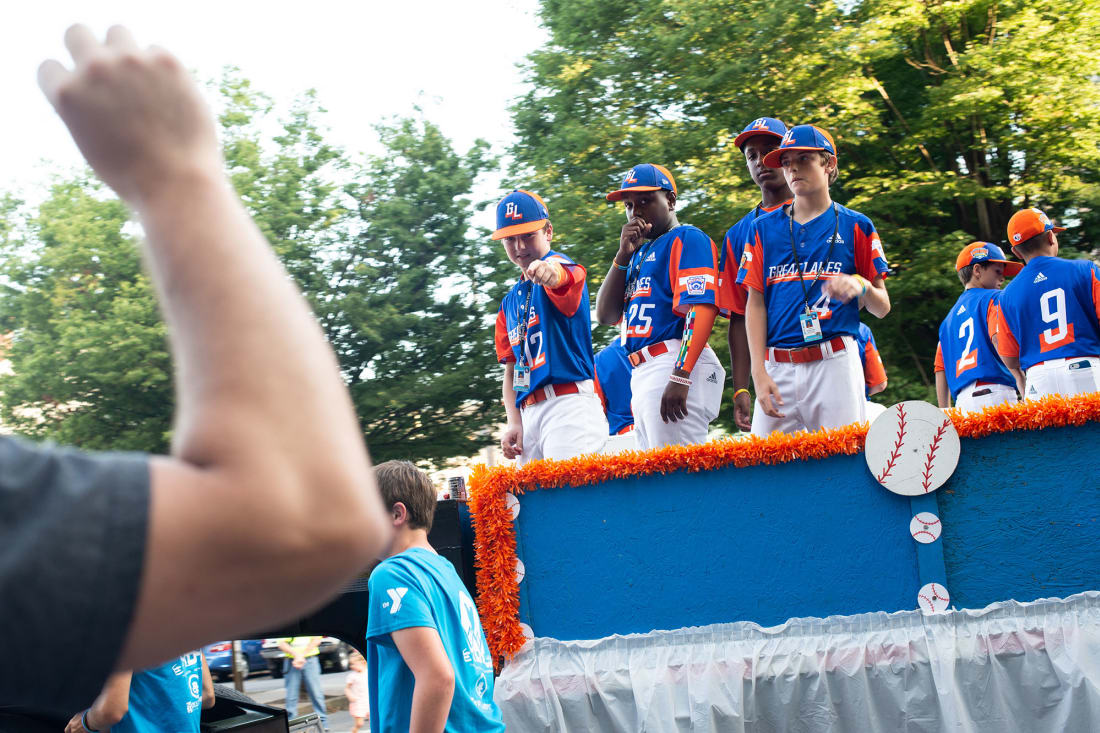 Great Lakes team riding parade float