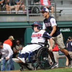 challenger game - player with wheelchair heading to home plate
