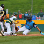 Caribbean player sliding into second