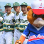 asia-pacific team laughing with dugout