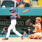 mid-atlantic player swinging bat