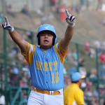 west player running home with hands in the air