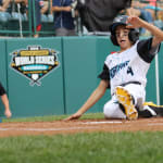 northwest player sliding into home