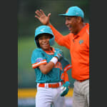 latin america coach and player laughing