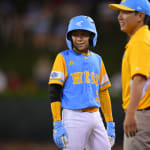 west player and coach smiling