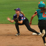 softball player catching ball on second