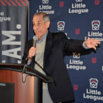 dennis-talking-podium1-web