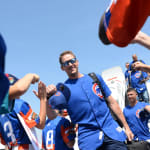 Cubs players walking off airplane