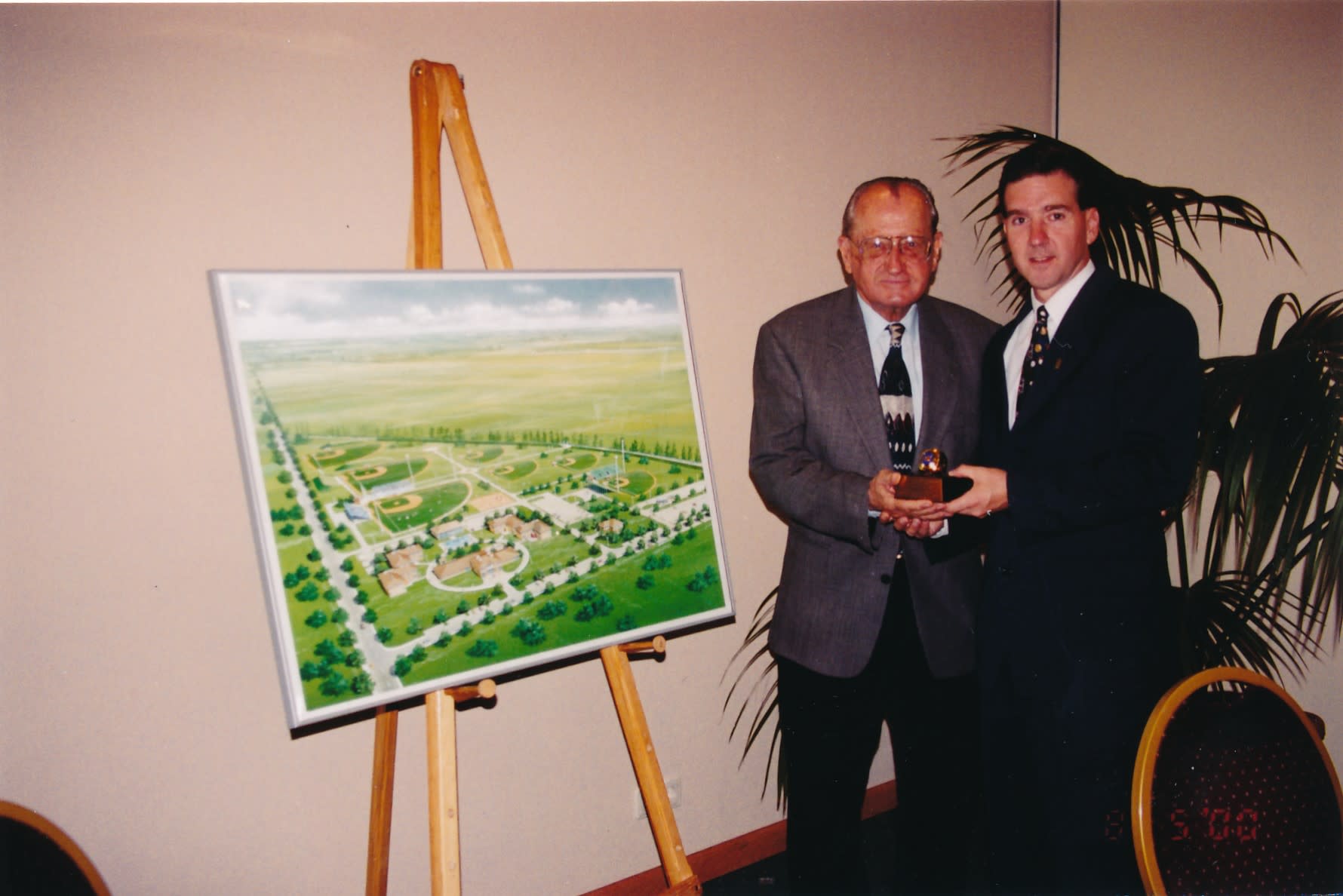 The late Ed Piszek (left) with Stephen D. Keener, Little League President and CEO, in Poland in 2000.