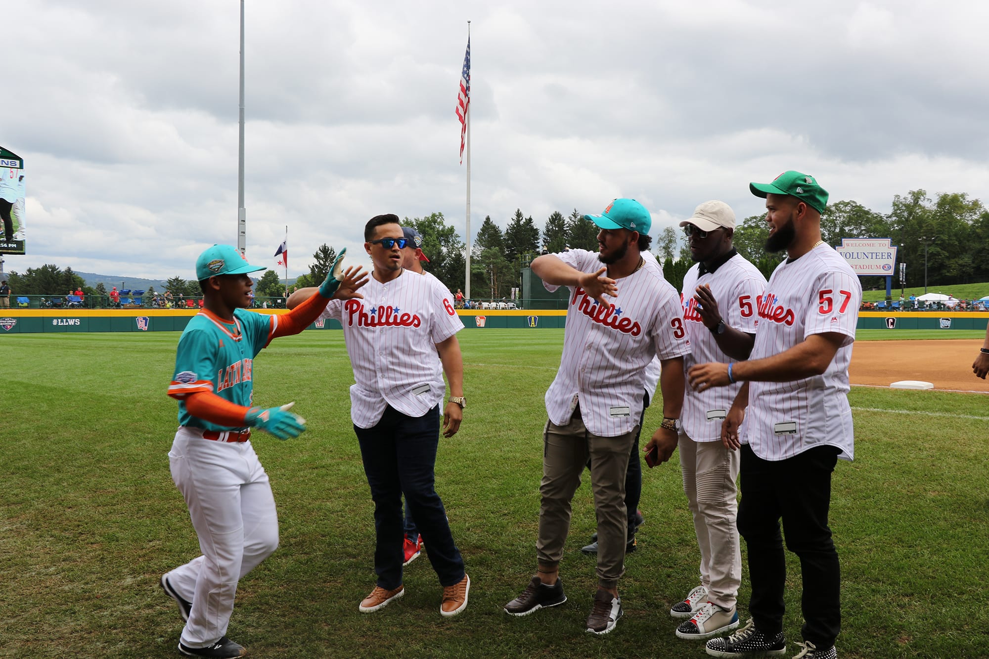 phillies players with japan team high fiving