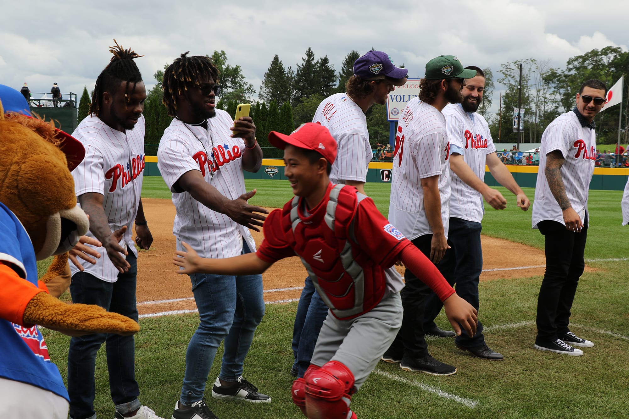 phillies players with japan team high fiving