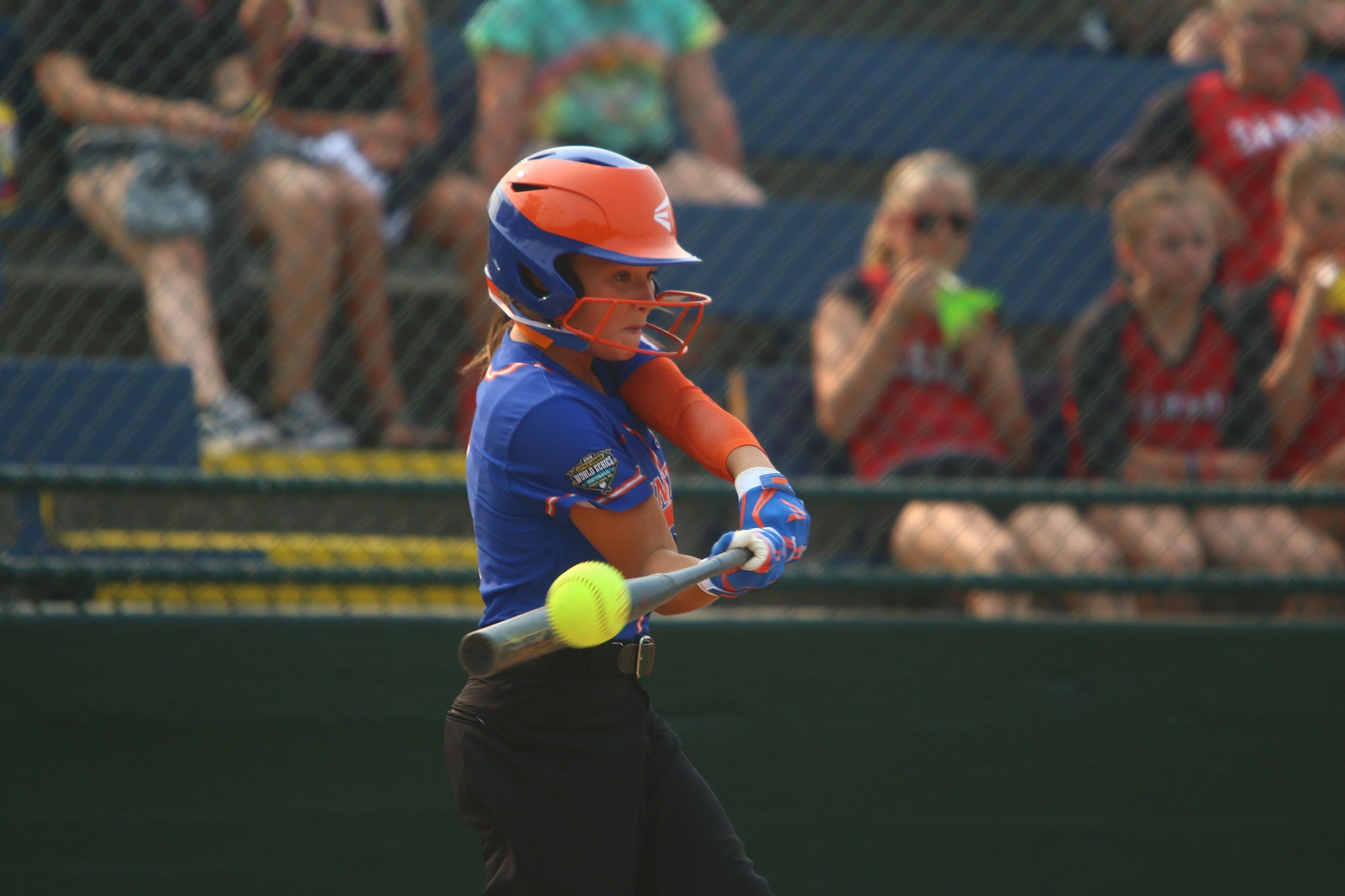 softball batter hitting ball