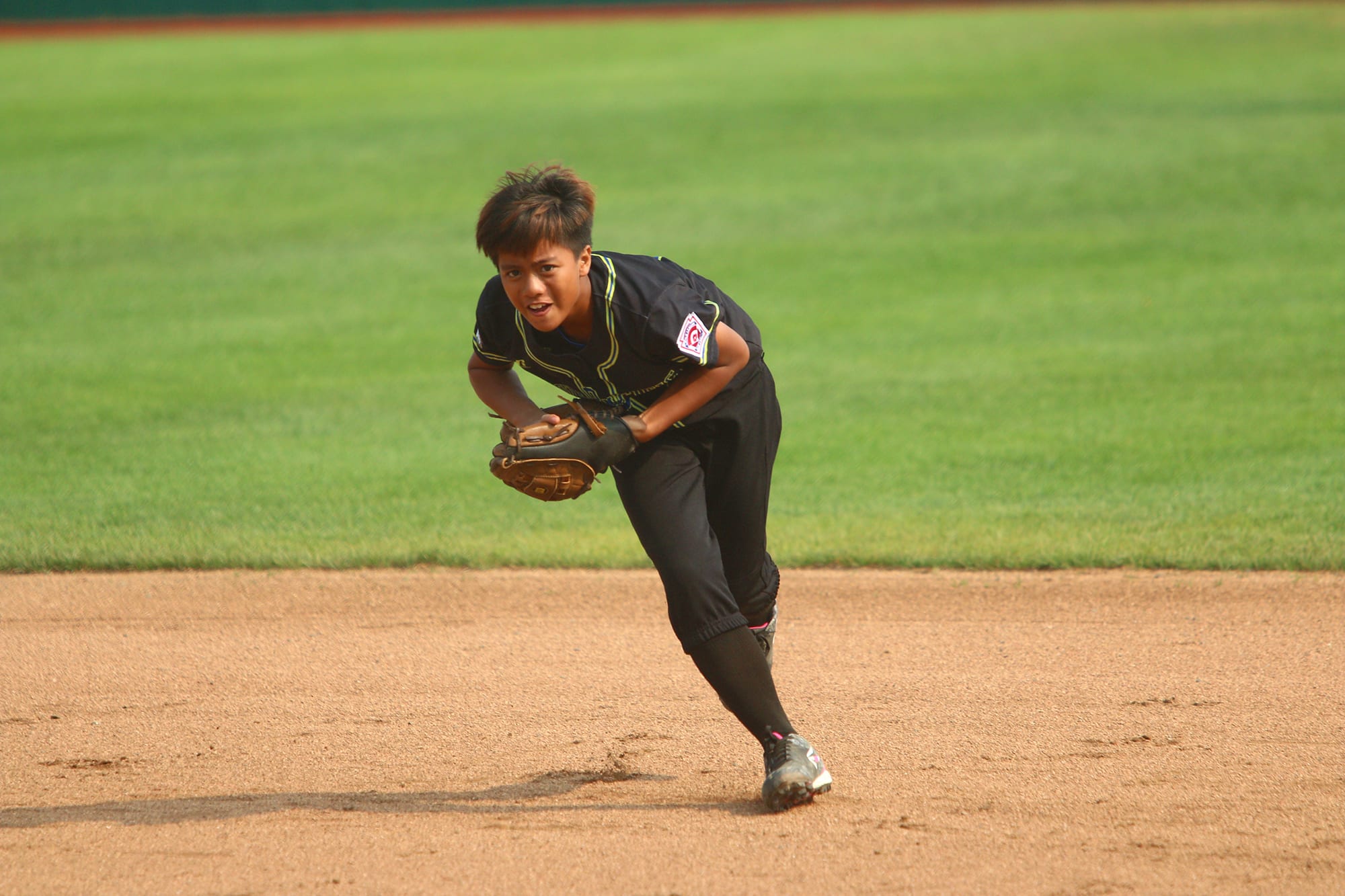 softball player throwing ball