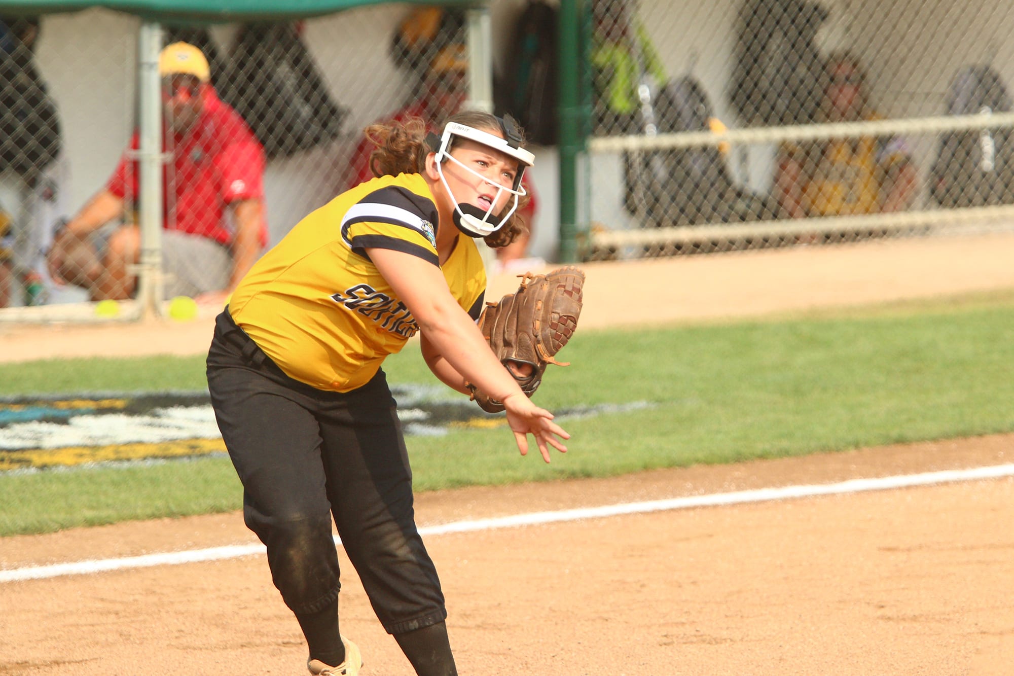 softball player throwing ball llsbws