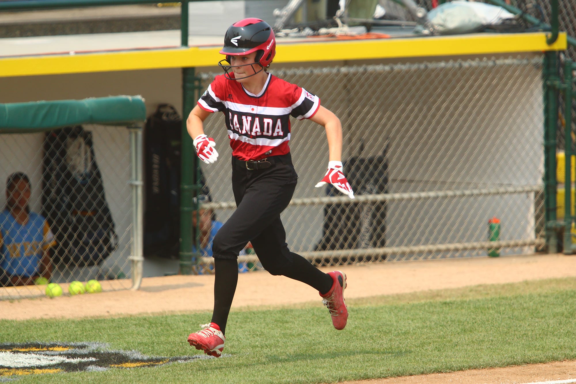 softball player running home