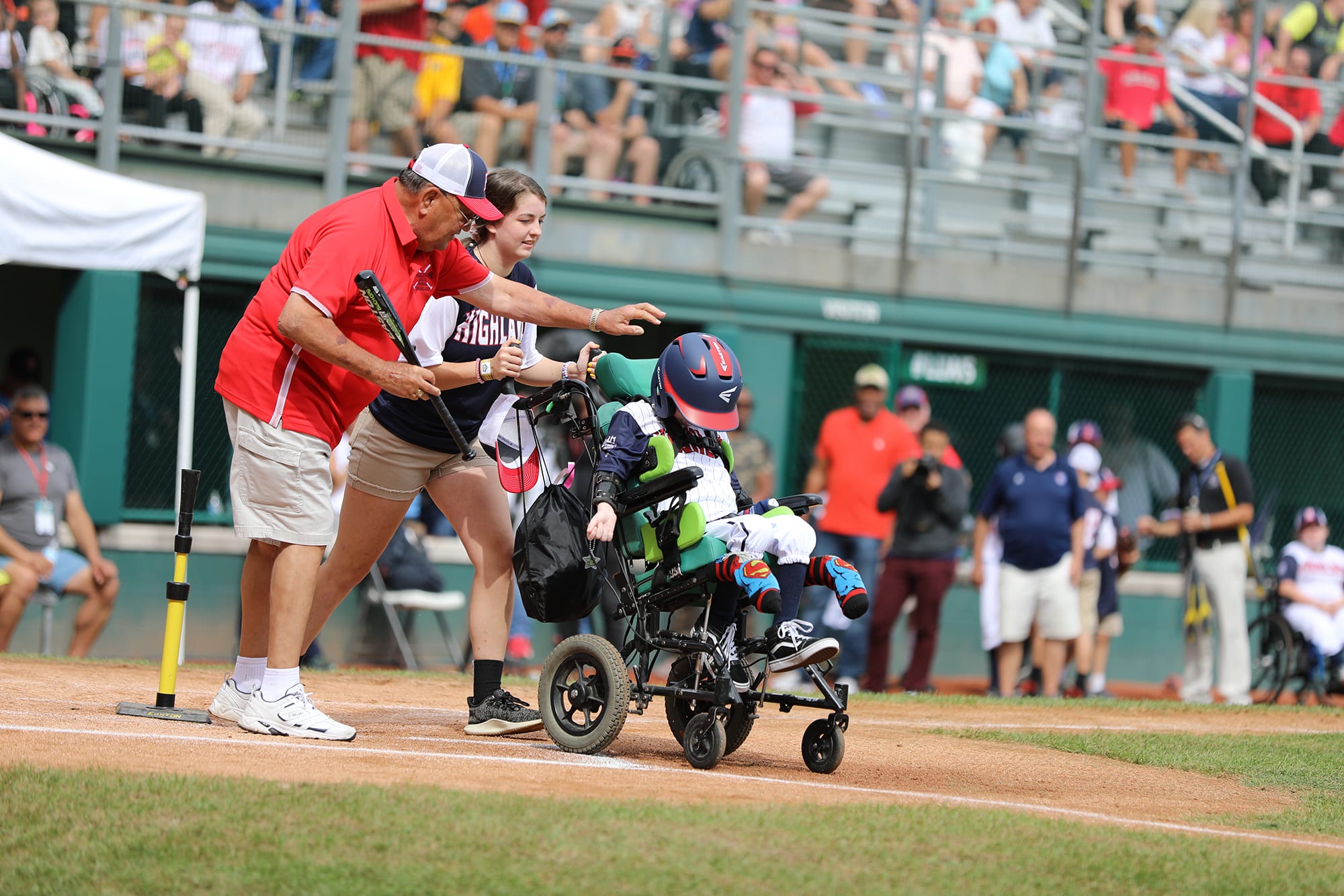 challenger game - buddy pushing player in wheelchair