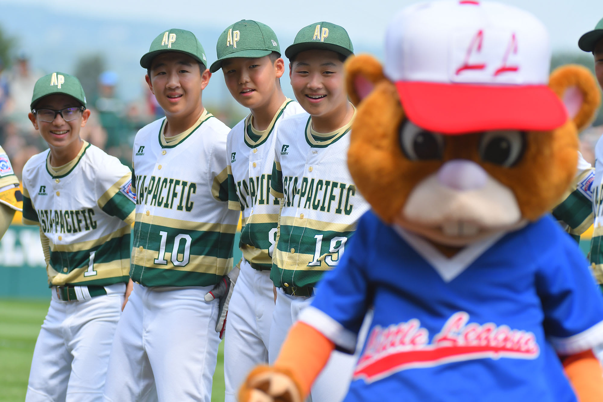 asia-pacific team laughing with dugout