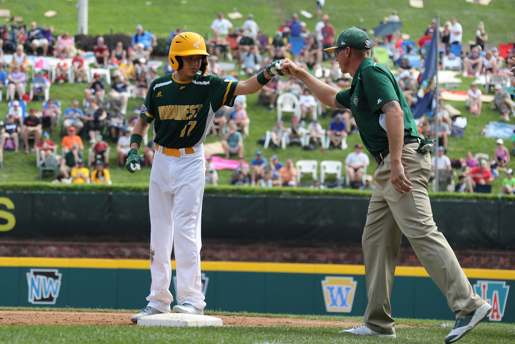 MW fist bumping coach