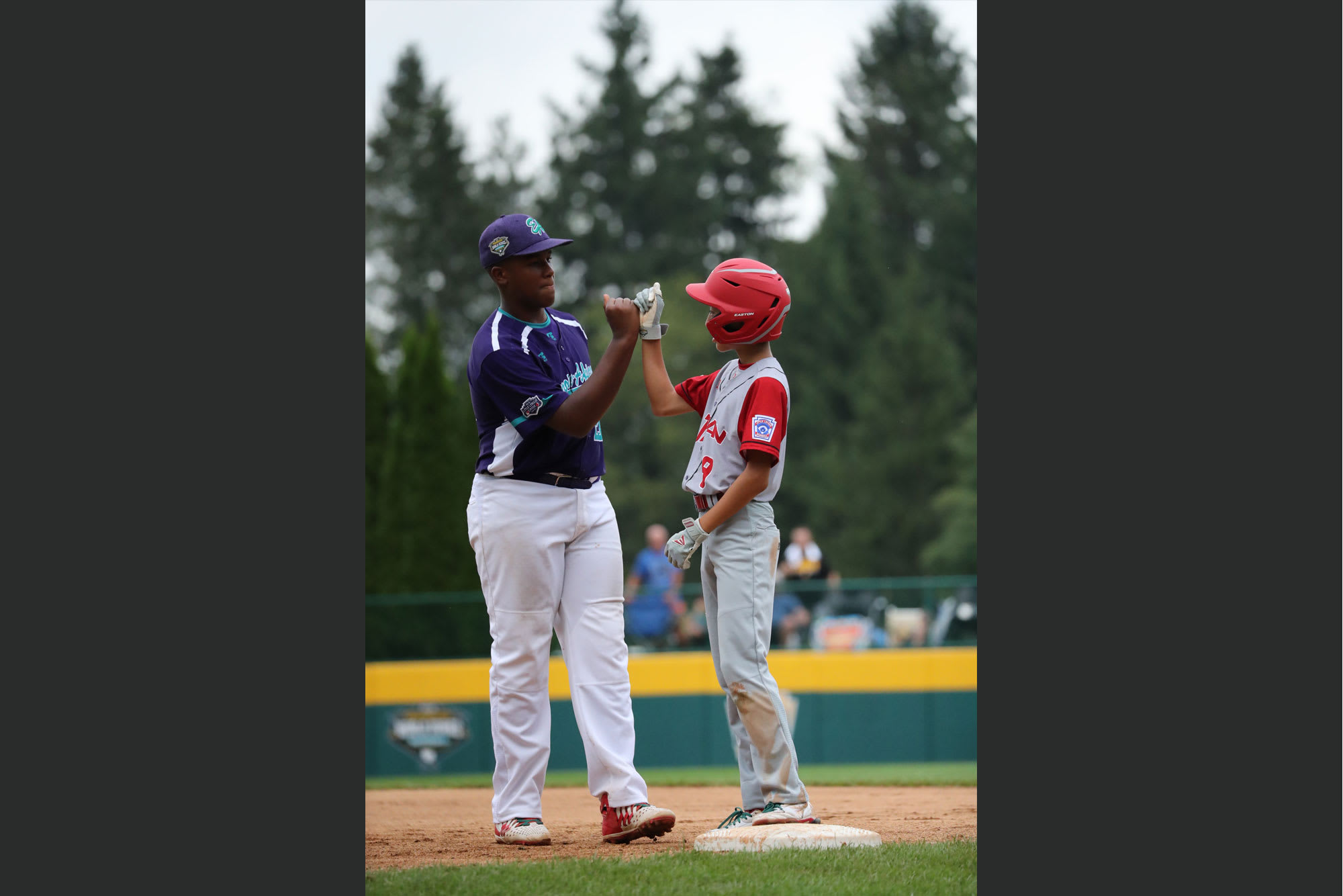 europe-africa & japan player fist bumping