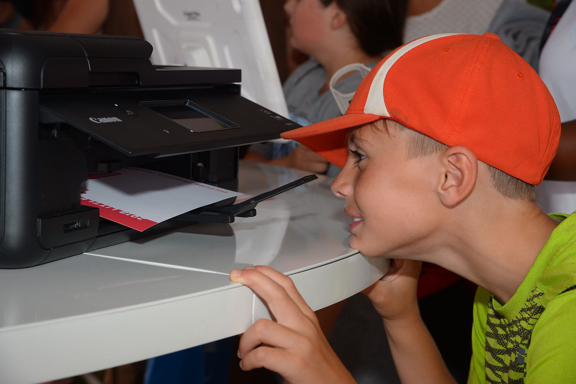 boy watching printer