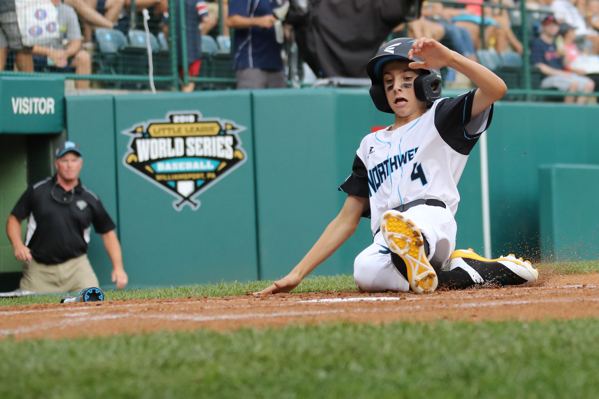 northwest player sliding into home