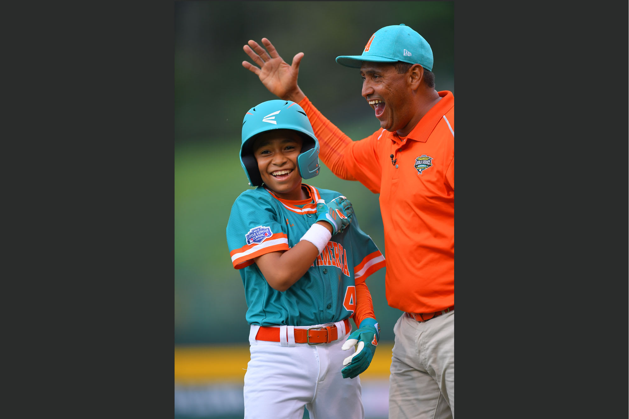 latin america coach and player laughing