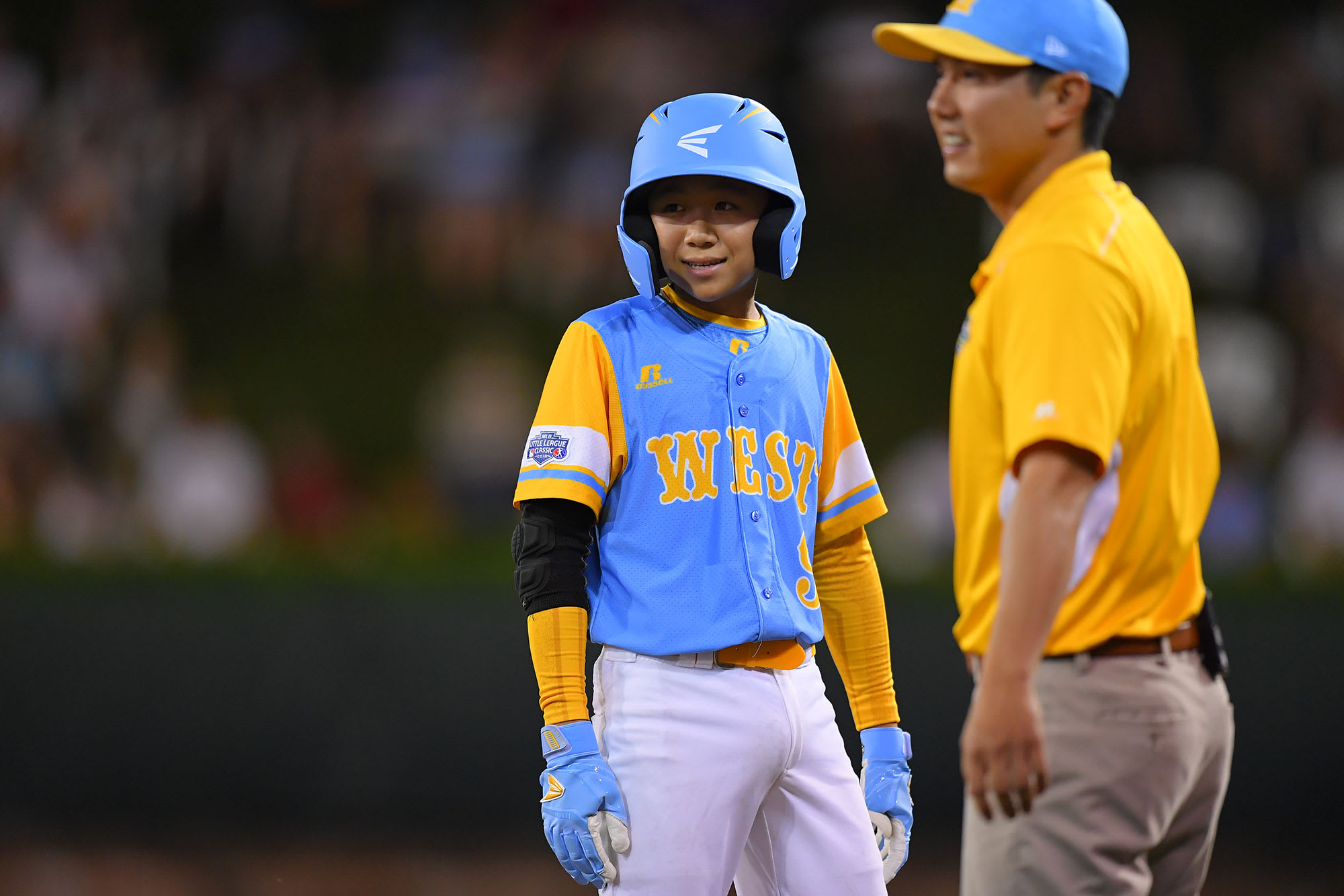 west player and coach smiling