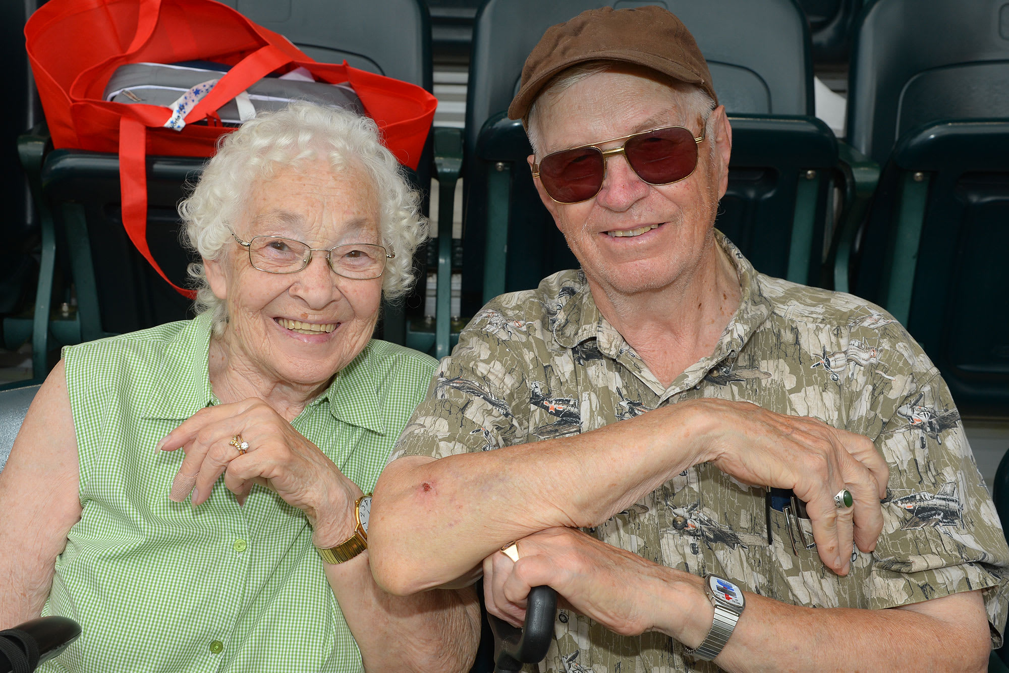 wife and husband watching baseball game