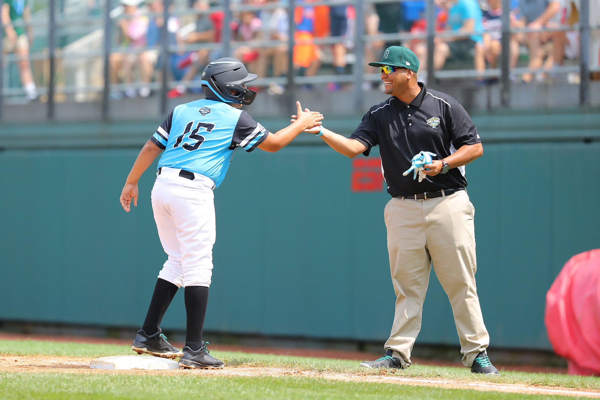 latin america player and coach high fiving