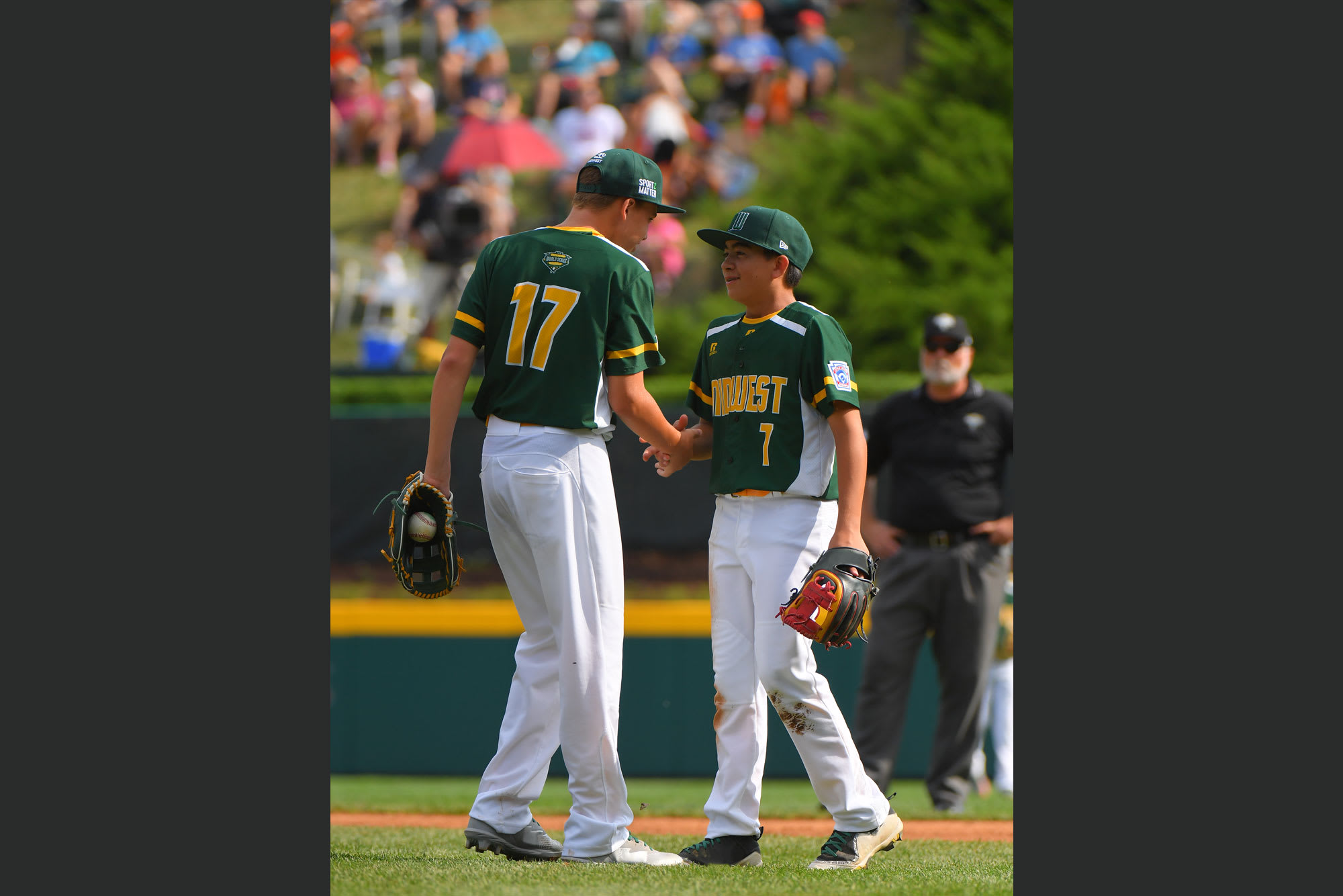 midwest players shaking hands