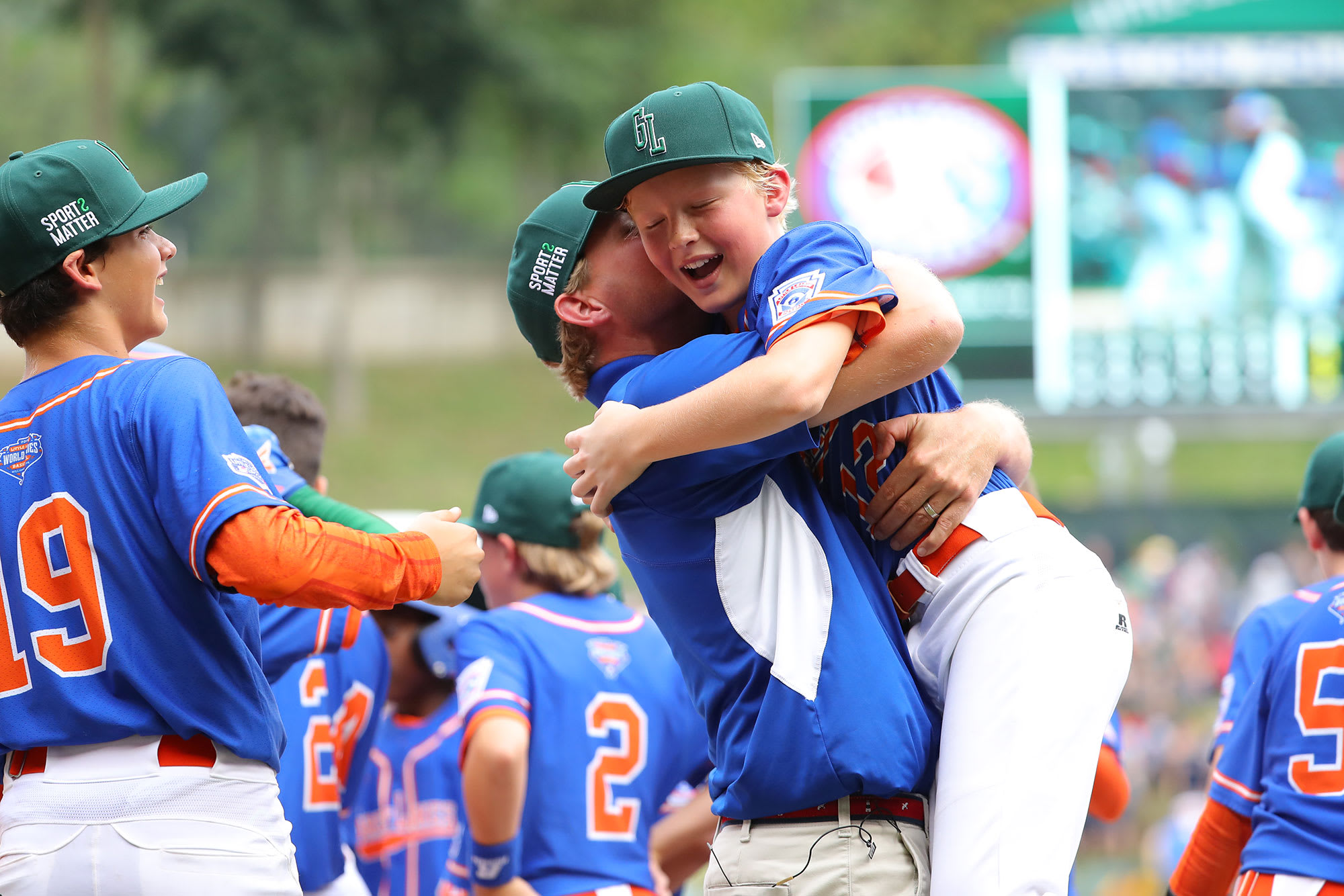 great lakes player hugging coach