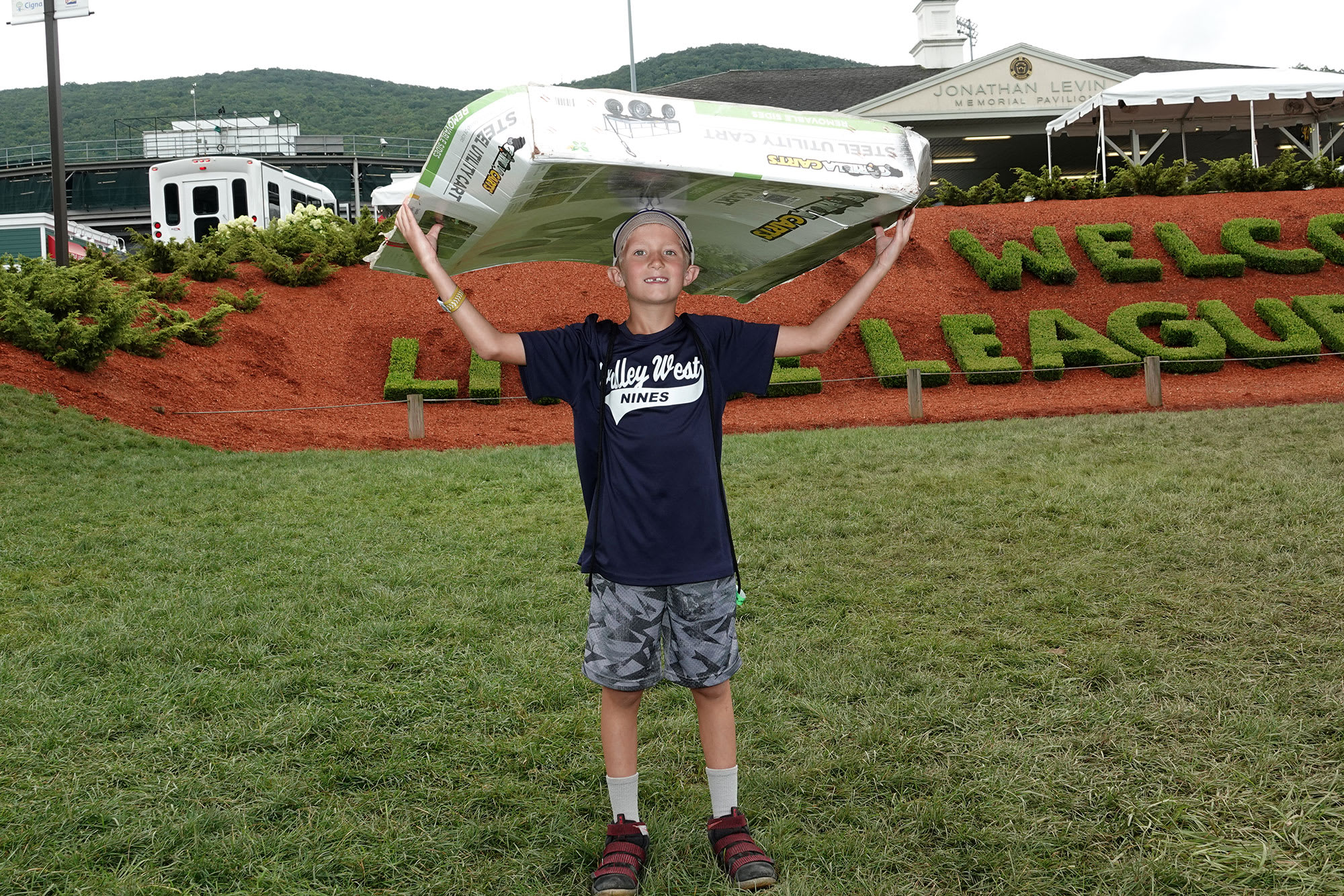 boy holding cardboard llbws