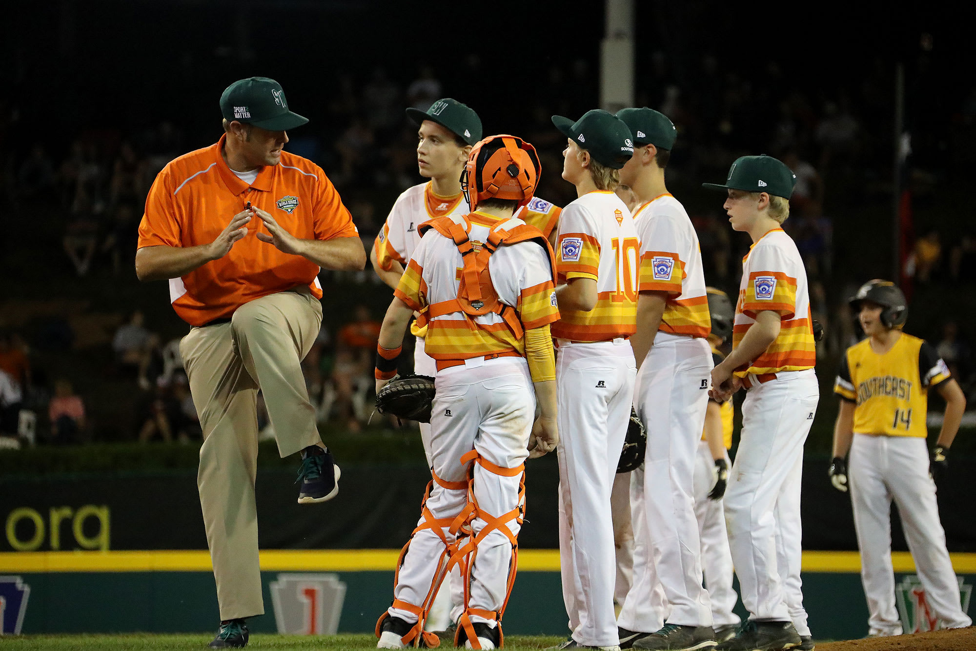 southwest team on mound with coach