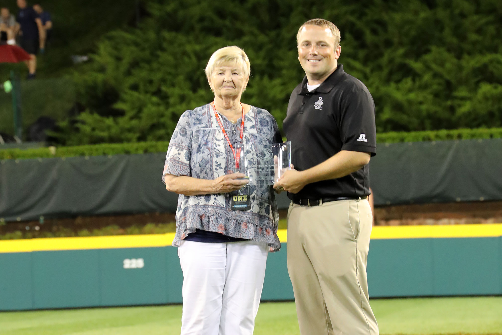 challenger award winner holding award