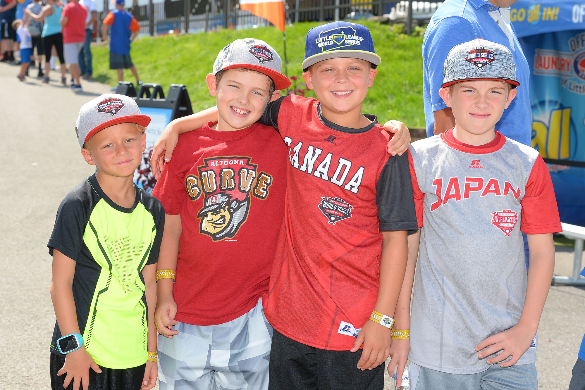 boys at family fun zone with arms around each other