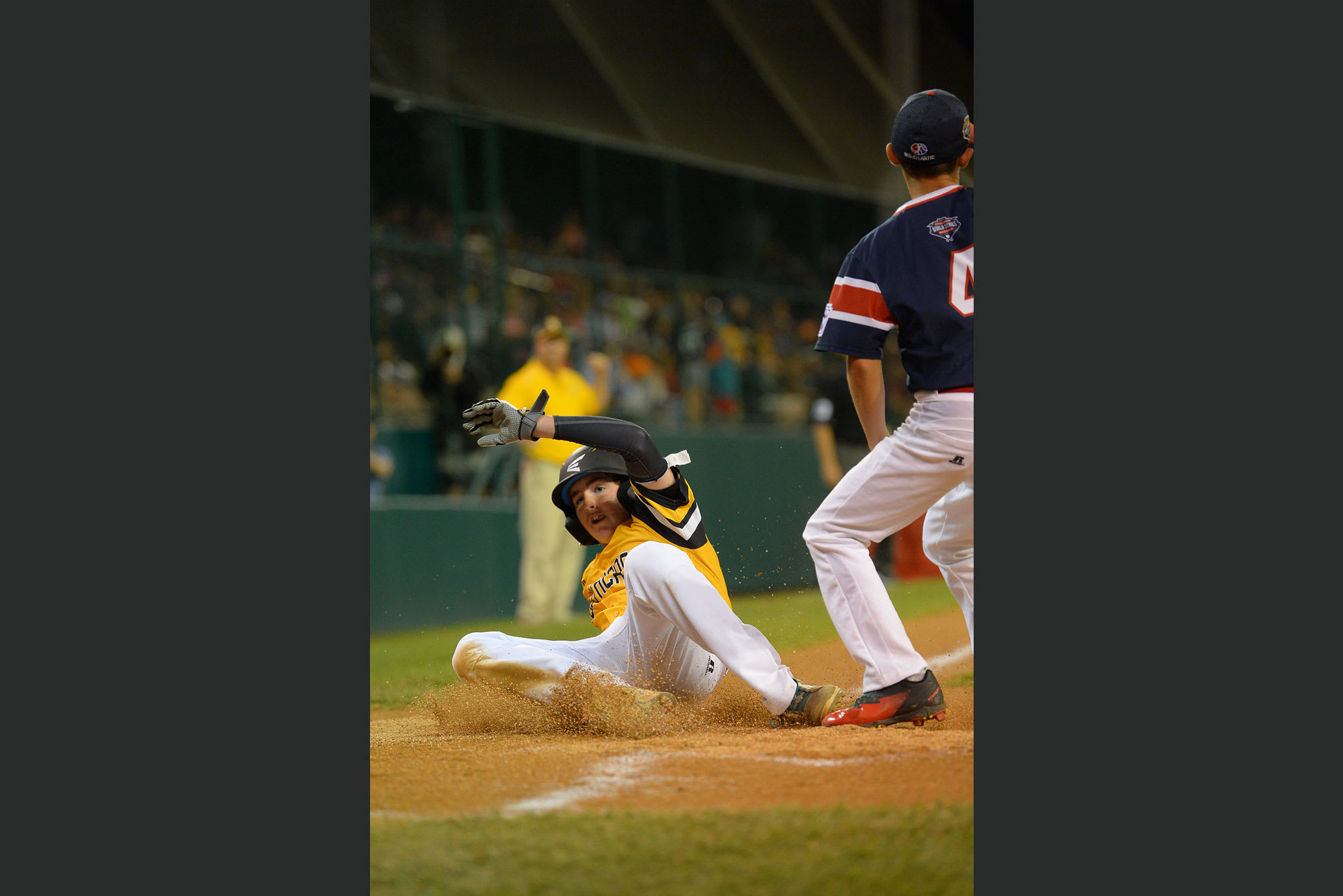 southeast player sliding home