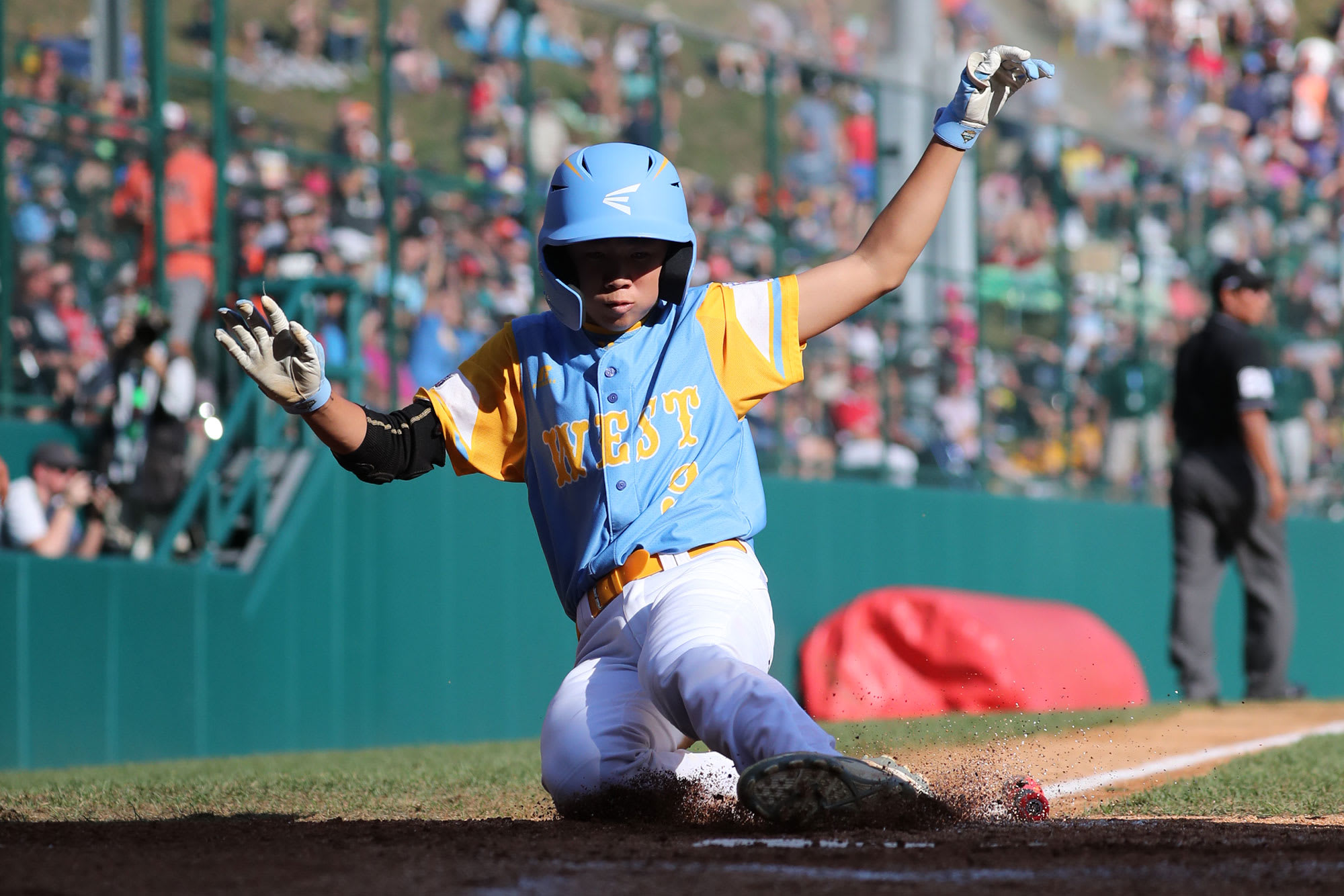 west player sliding into home