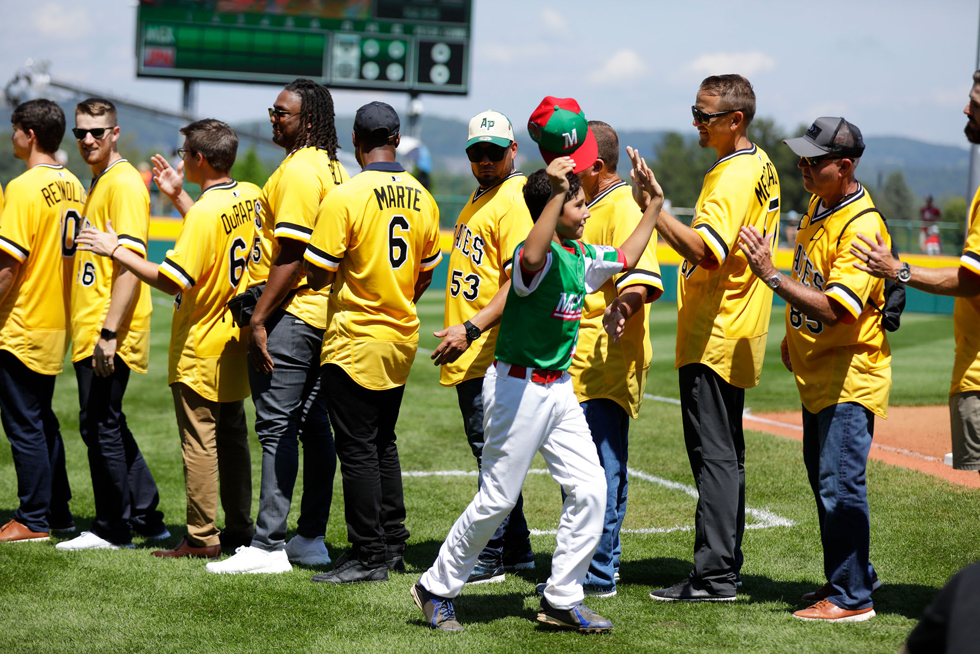 Mexico player highfiving Pirates players