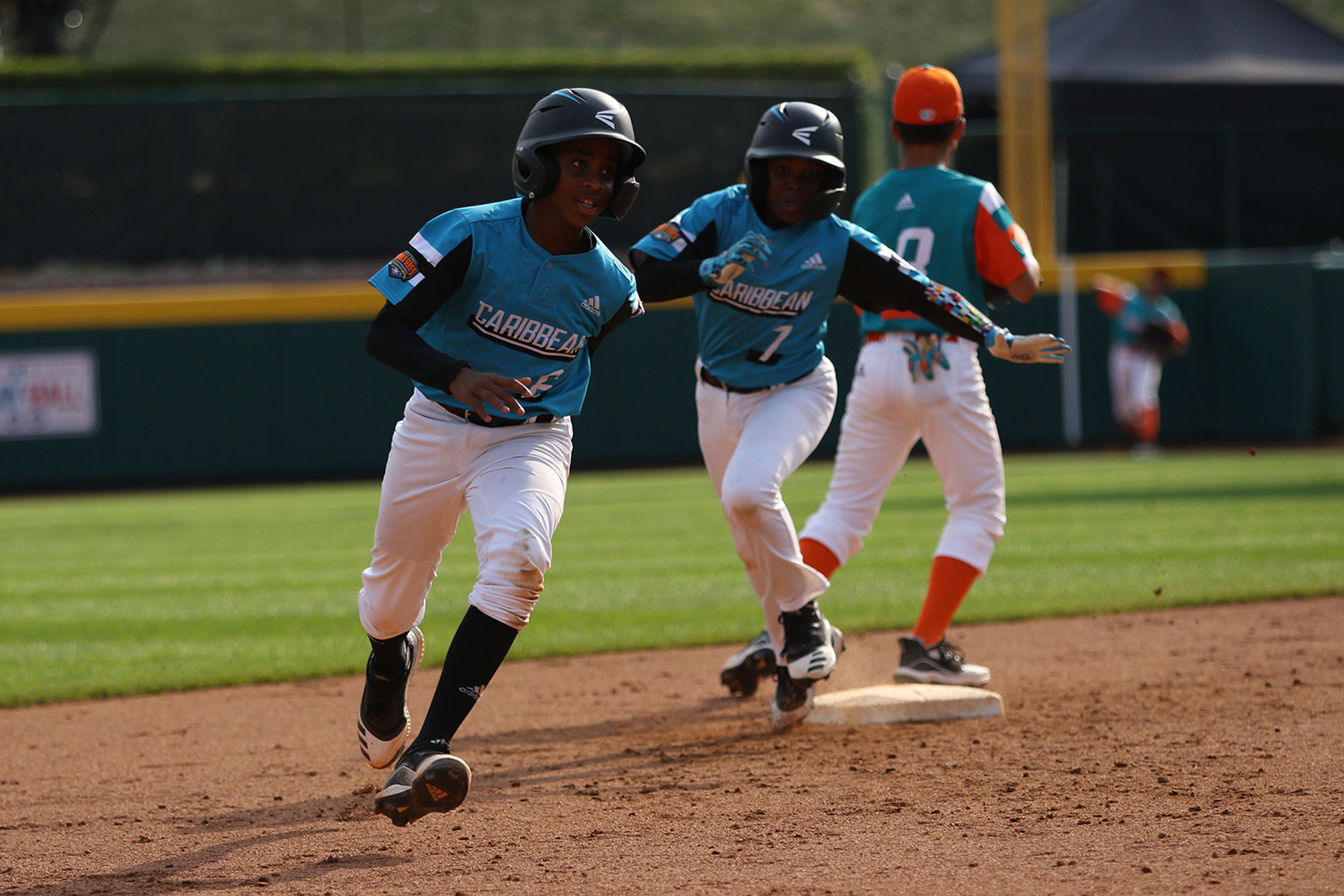 caribbean players rounding second