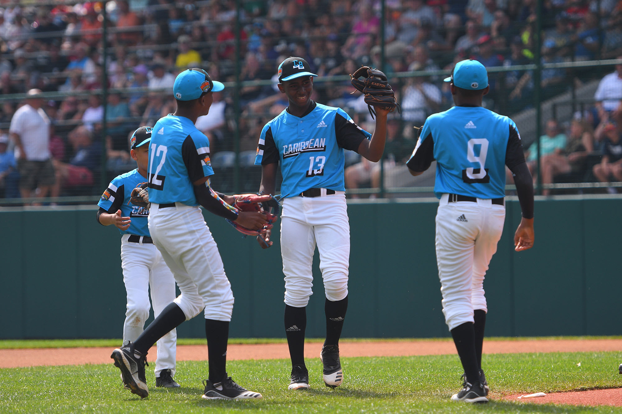 caribbean player high fiving