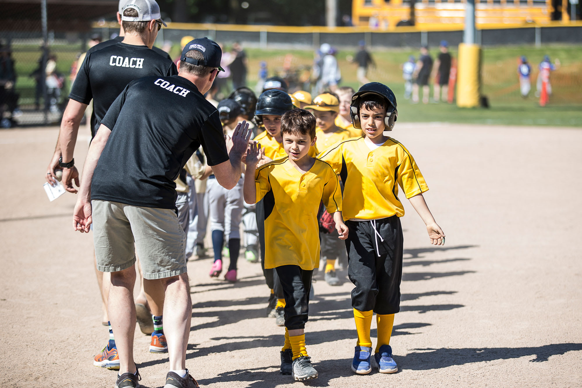 coaches-high-fiving-team