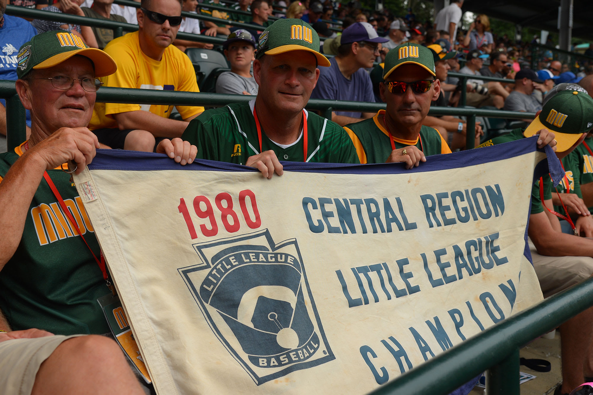 Jim-Perkovich with others holding banner