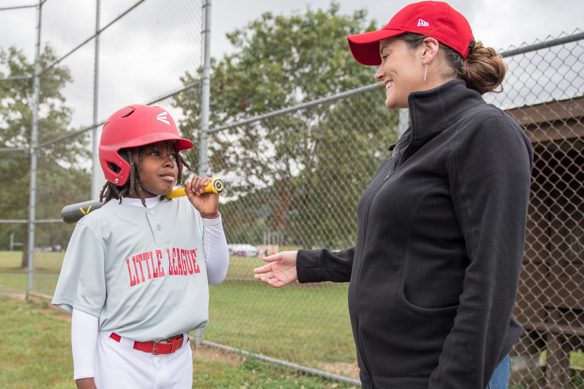 Mom talking to Little Leaguer